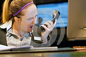 Woman swears with the client by phone