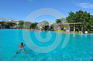 Woman swim in Cairns Esplanade Swimming Lagoon in Queensland Australia