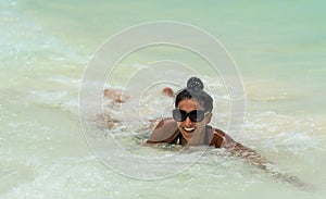 Woman swim in the caribbean sea in Cuba