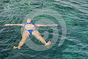 Woman swiming in the sea. Beautiful girl swiming at tropical island
