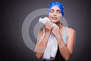 The woman swimmer against grey background