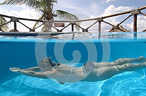 Woman swimming, Cozumel, Mexico photo