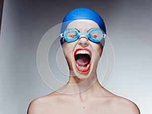 woman in swimming gear naked shoulders red lips close-up