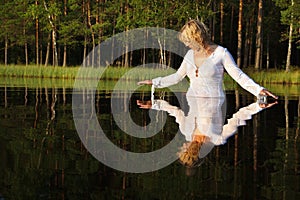 Woman swimming in lake