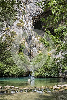 Woman swimming in natural pool at Cueva del Gato Spain