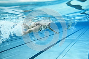 Woman swimming in outdoor pool