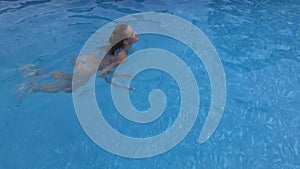 Woman swimming in the pool