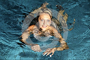 The woman in swimming pool