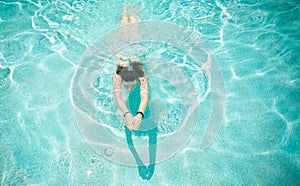 Woman Swimming in Pool photo