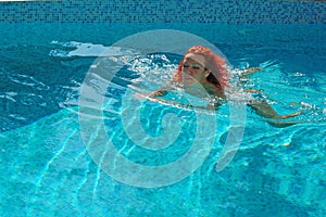 Woman swimming in pool