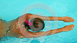 Woman swimming in pool