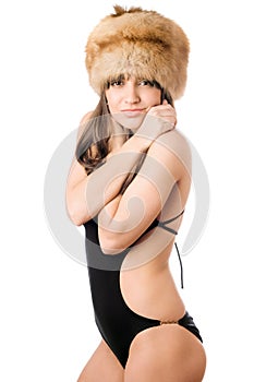 Woman in swimsuit and fur-cap