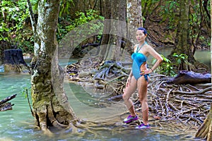 Woman in swimsuit pretty at Huai Mae Khamin waterfall and natural