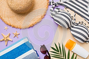 Woman swimwear and beach accessories flat lay top view on colored background Summer travel concept. bikini swimsuit