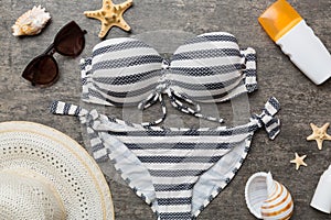 Woman swimwear and beach accessories flat lay top view on colored background Summer travel concept. bikini swimsuit