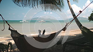 Woman swing in hammock sibaltan tropical beach