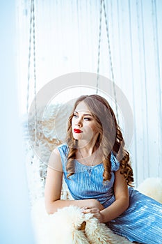 Woman on a swing in the Studio