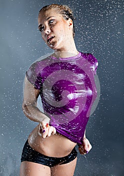 Woman with T-shirt in water droplets