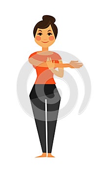 Woman in T-short and leggings does flexibility excersice