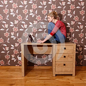 Woman on table in home office