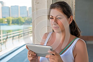 Woman with a tablet in urban locations