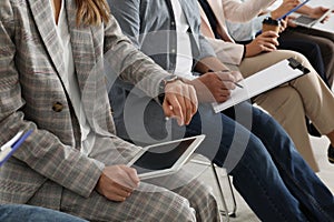 Woman with tablet waiting for job interview in office