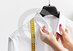 Woman tailoring business shirt