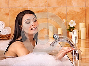 Woman take bubble bath.