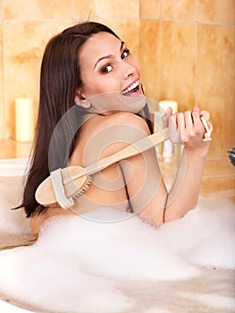 Woman take bubble bath.