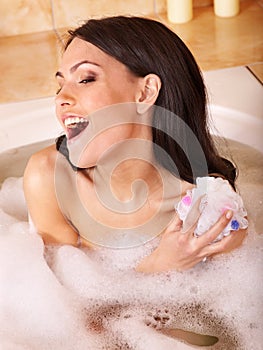 Woman take bubble bath.