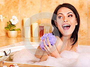 Woman take bubble bath.
