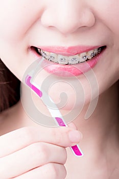 Woman take interdental brush