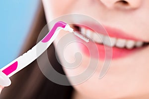 Woman take interdental brush