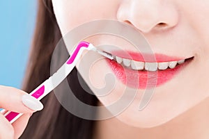 Woman take interdental brush