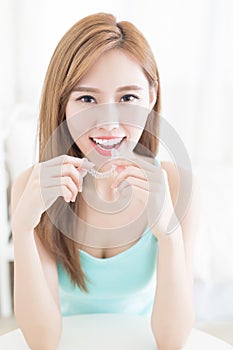 Woman take invisible braces
