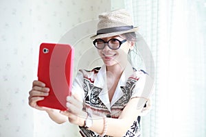 Woman take a photo by smart phone tablet
