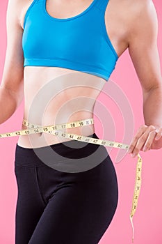Woman take waist scale