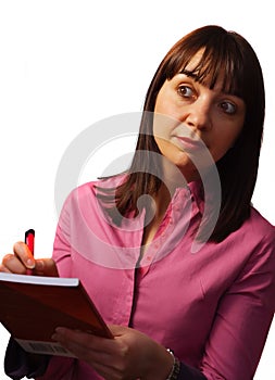 Woman takes notes and observes photo