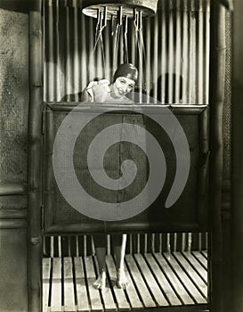 Woman takes a shower in a bathing cap