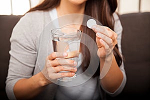 Woman taking an antacid