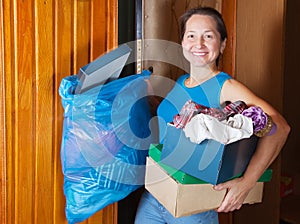 Woman taking away the garbage