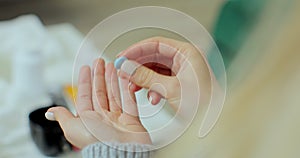 Woman taking a blue cold pill. The woman has a cold and is taking medication for the disease. Pharmacy and treatment