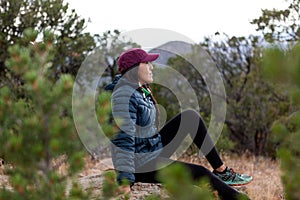 Woman taking a break from hiking