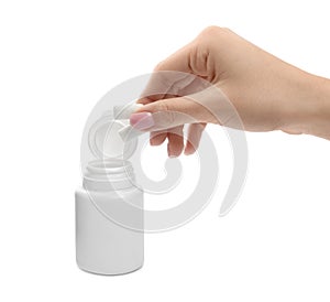 Woman taking chewing gum pieces from jar on white background, closeup