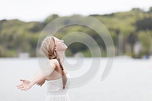 Woman taking deep breath photo