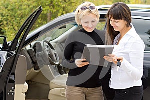 Woman taking delivery of her new car