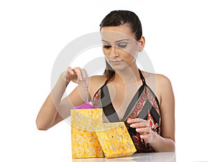 Woman taking the gift from gift box