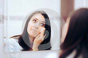 Woman Taking Her Make-up of Using a Cotton Wool Ball