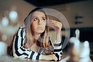 Woman Taking her Wedding Ring of Thinking of Divorce