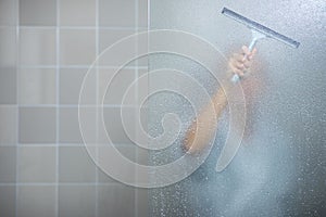 Woman taking a long hot shower washing her hair